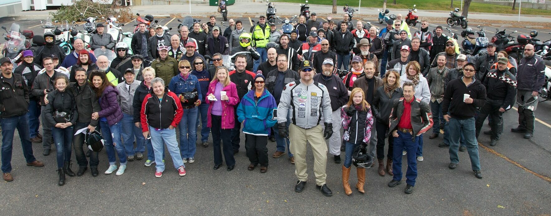 Group shot of riders participating in fundraising scooter ride