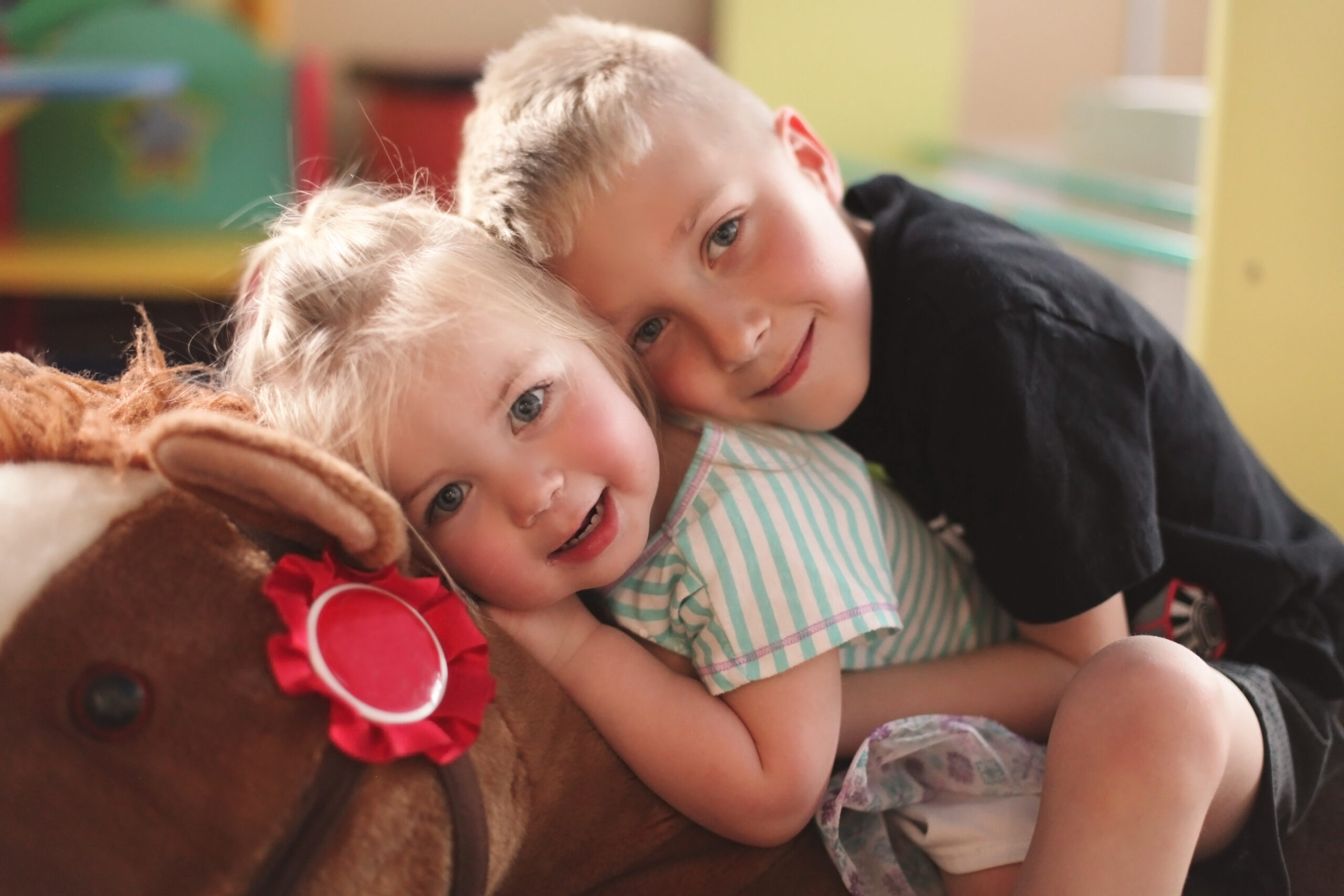 RMHC family - two kids on rocking horse